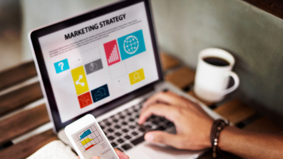 Man reviewing marketing strategy on a laptop