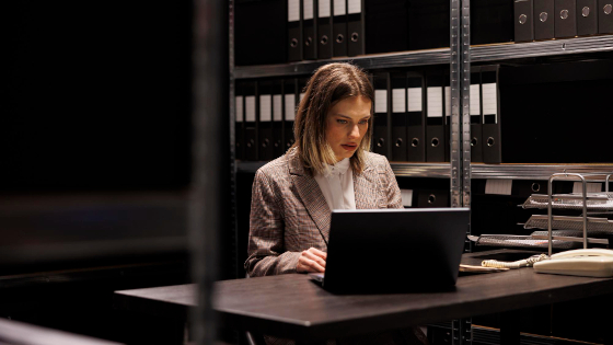 A business woman typing on the computer