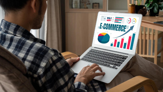 Man looking at a dashboard of sale analysis for online retail business